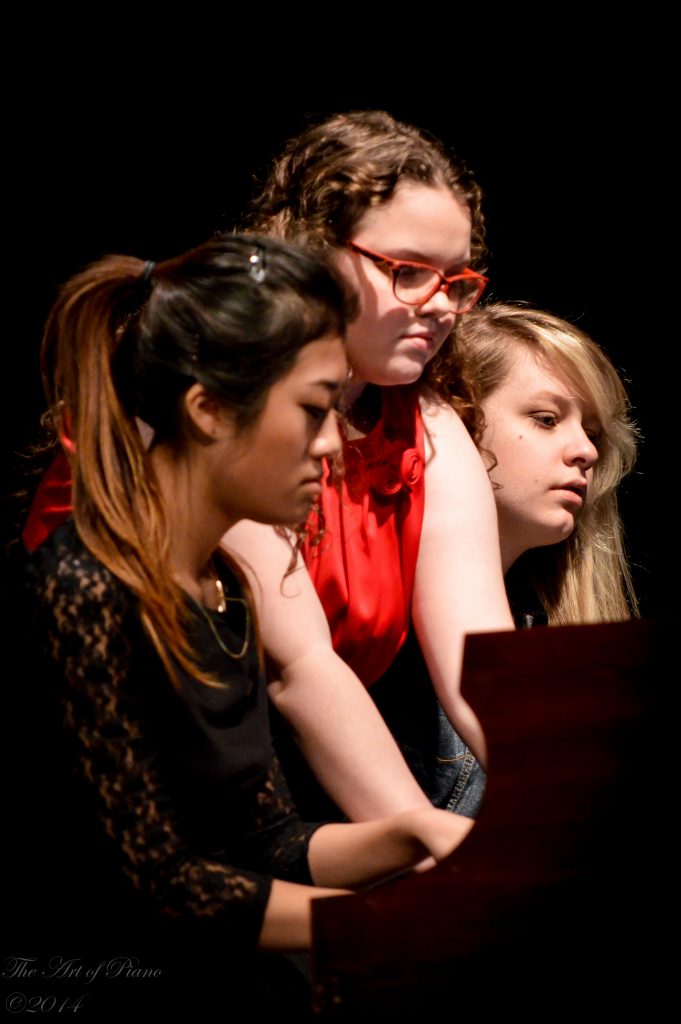 Programs: Three older students perform a piano trio