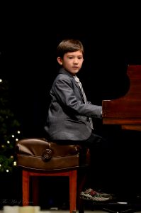 Student Performance Videos: A very young boy is ready to perform